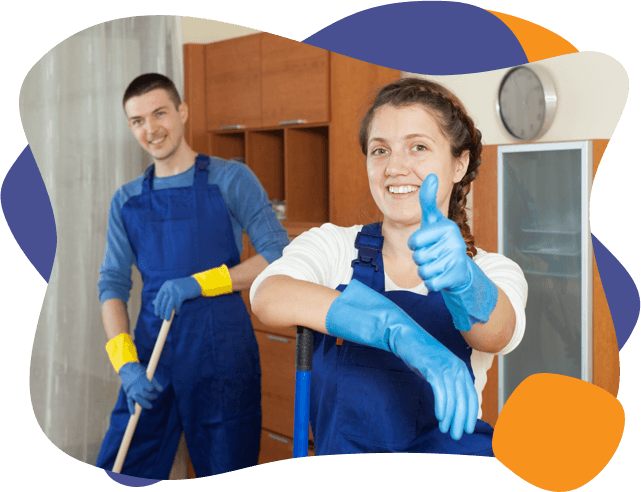 cleaners having fun on the job and giving a thumbs up in their cleaning gear during mold removal